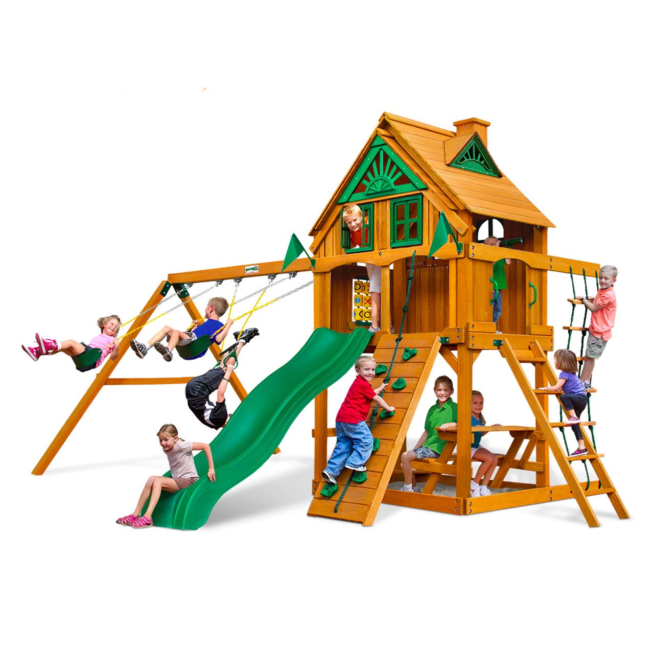 Wooden playset with green wave slide, swings, rock climbing wall, picnic table, and tic-tac-toe panel with children playing