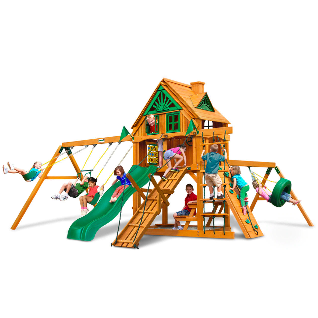 Amber-finished wooden playset with green slide, swings, climbing ramps, tire swing, and playhouse with children playing