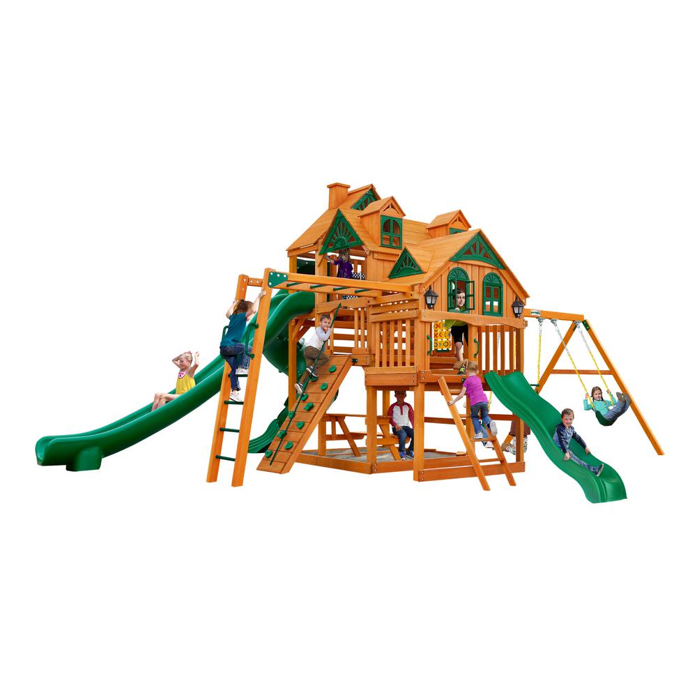 Empire AP Wooden Swing Set with amber cedar wood, three play decks with wood roofs, green slides, monkey bars, climbing wall, swings, and playhouse features