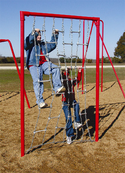 Outdoor climbing net with metal chains and bars, red frame, two children climbing, wood chip ground surface