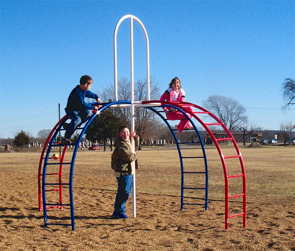Children climbing a red and blue metal climbing structure with a central pole in an outdoor playground