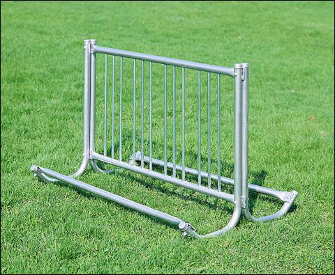 Modern Double Sided Bicycle Rack with galvanized steel tubing, vertical bars, portable on grass background, 10 bicycle capacity