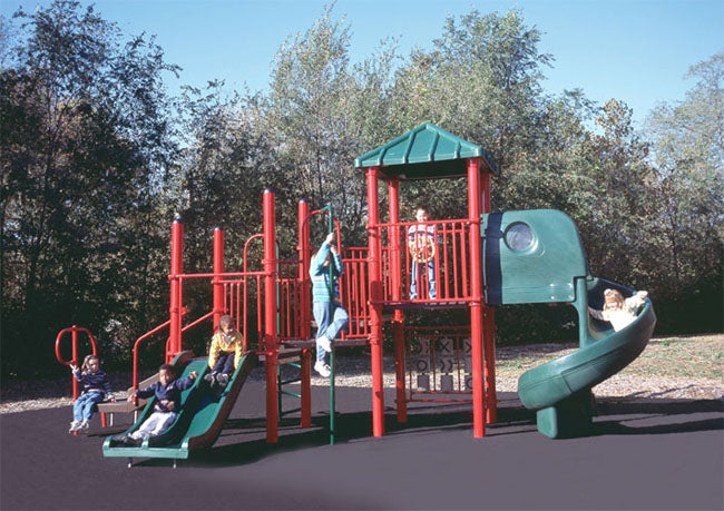 Outdoor modular playground with red posts, green slides, climbing structures, and children playing actively