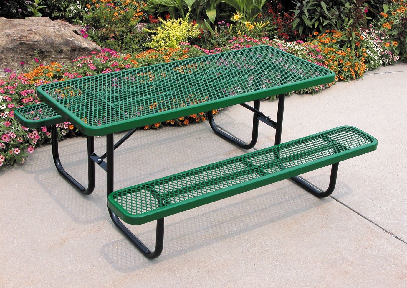 Heavy Duty Rectangular Table with green diamond-patterned metal top, black powder-coated frame, and attached benches in outdoor setting