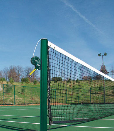 Official Tennis Posts set of 2 with green powder-coated steel posts, grooved aluminum caps, net reel, and fittings on outdoor court