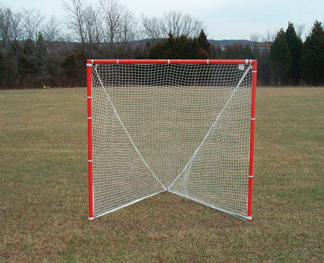 Lacrosse Goal and Net Pair with red steel frame and white braided nylon net on grassy field with trees in background