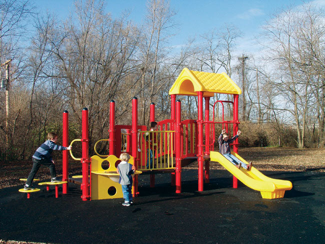 Red and yellow modular playground with wide slide, stepping stones, fire pole, and children playing outdoors