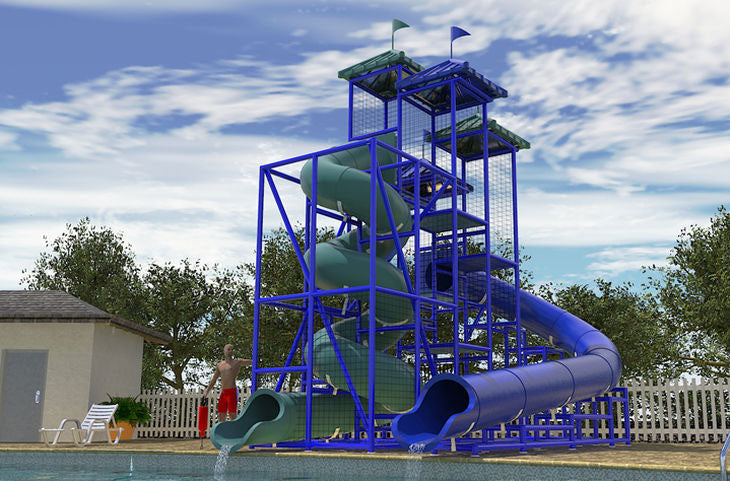 The Coral Sea Water Slide with two blue and green flumes, spiral and curved, by a pool surrounded by trees and a person nearby