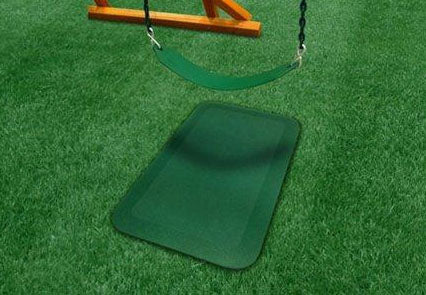 Rubber Ground Protection Wear Mat in green placed under a swing on artificial grass, preventing soil wear and mud buildup