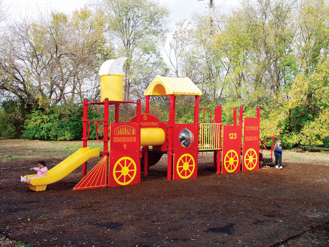 Red and yellow modular train-shaped playground with slides and climbing features, children playing outdoors