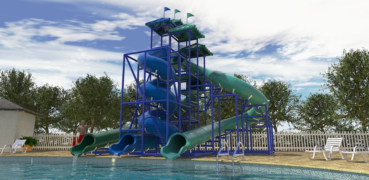 Three large green and blue spiral and curved water slides with metal frame by poolside with lounge chairs and trees