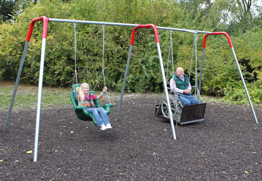 Outdoor ADA swing set with molded seat and wheelchair-accessible platform swing surrounded by greenery