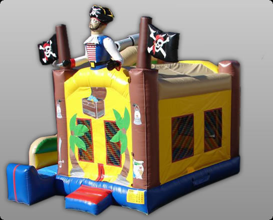 Inflatable pirate-themed bounce house with skull flags, treasure chest graphics, and a pirate figure on top