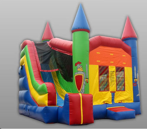 Colorful inflatable castle bounce house with turrets, slide, and medieval knight graphics on vinyl walls