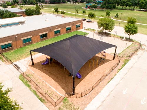 Rectangle Superspan Hip Roof Shade Structure with four posts providing UV protection over playground equipment at a school playground