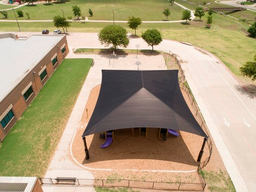 Rectangular black hip roof shade structure with four posts covering playground equipment, providing UV protection
