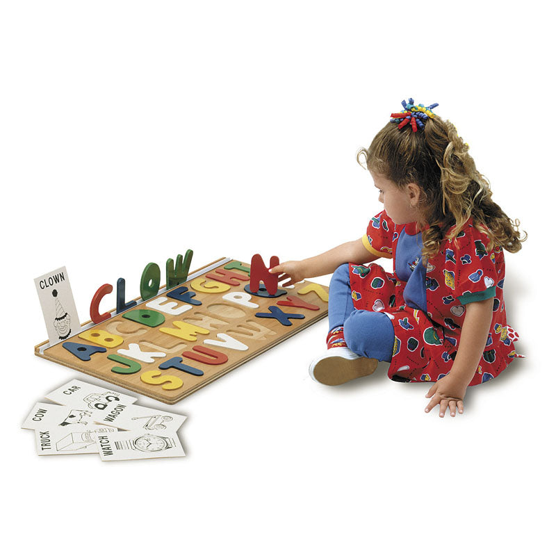 I Can Spell! Alphabet Puzzle with colorful raised letters and word cards on white background, child playing