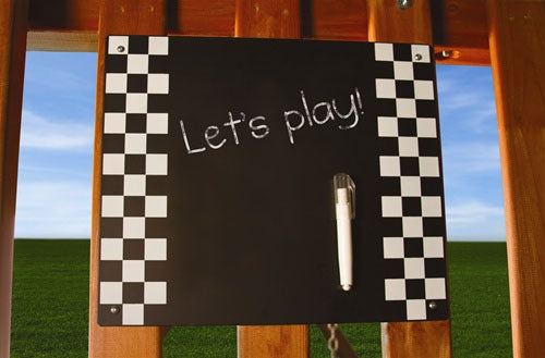 Chalkboard Swing Set Accessory with black metal chalkboard, checkered border, and magnetic chalk holder attached outdoors