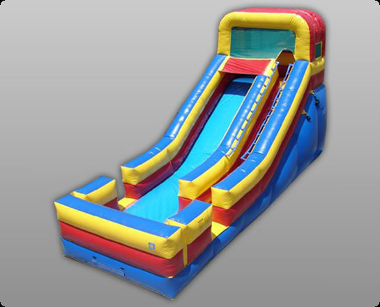 Vibrant blue, red, and yellow inflatable single lane slide with safety netting and attached splash pool.