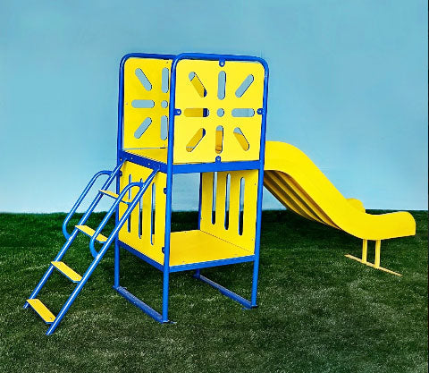 Compact playground slide with blue metal frame, yellow cutout panels, ladder, and wide slide on grass