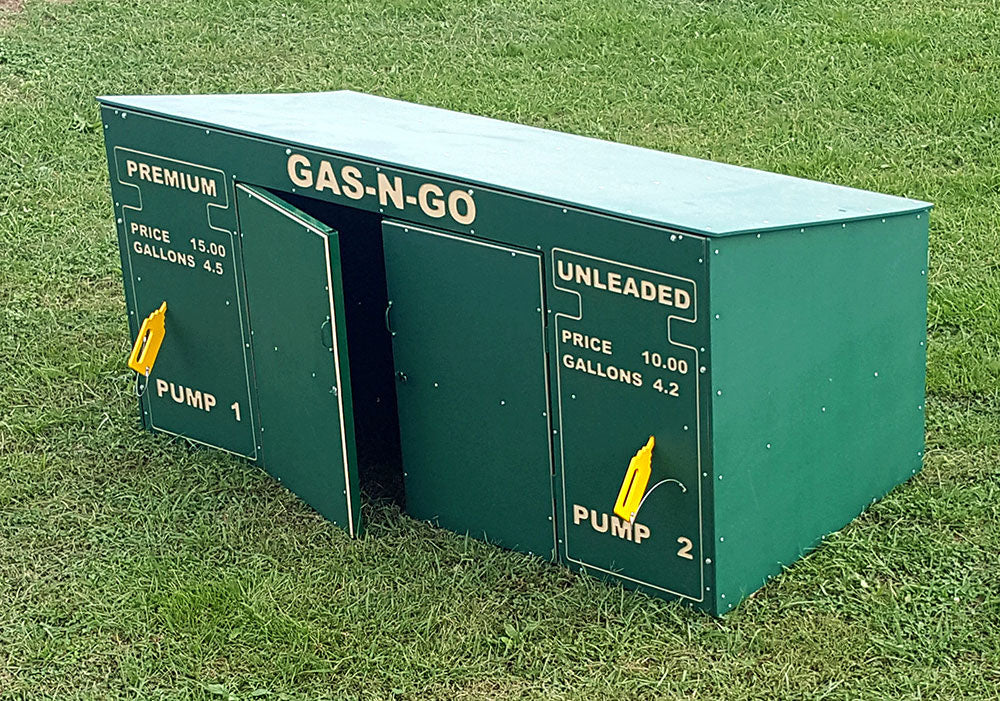 Green outdoor trike storage unit with lockable doors and two yellow pump handles on grass