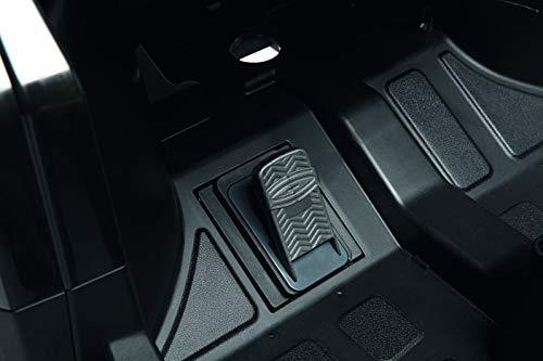 Black textured foot pedal with zigzag grip pattern on ride-on vehicle floorboard