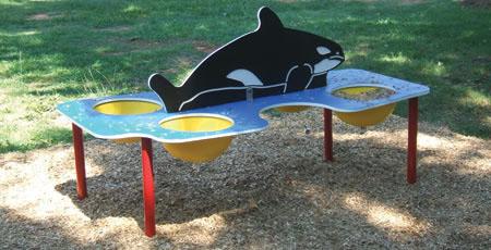 Children's outdoor sand and water play table with whale-shaped backrest and three yellow sensory bowls