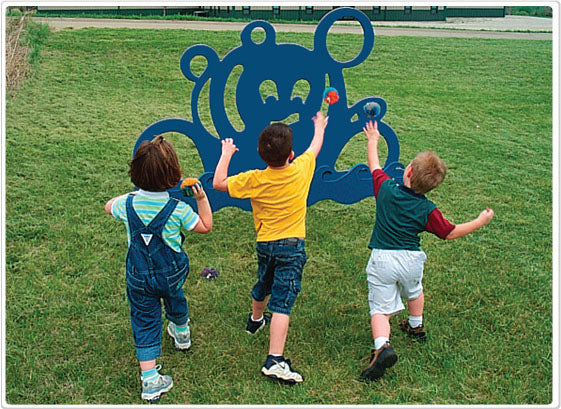 Three children tossing bean bags at a blue octopus-shaped outdoor play target on grass