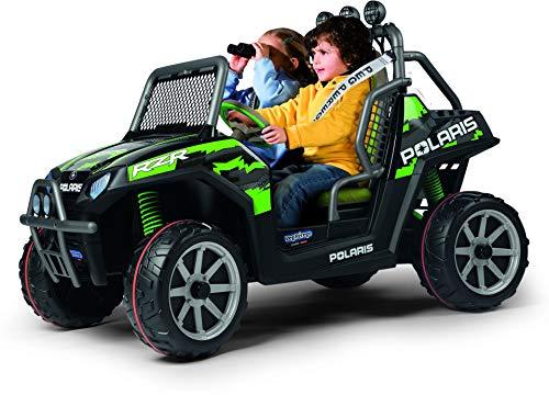 Green and black electric ride-on vehicle with off-road tires, roll bar, side-by-side bucket seats, and two children seated