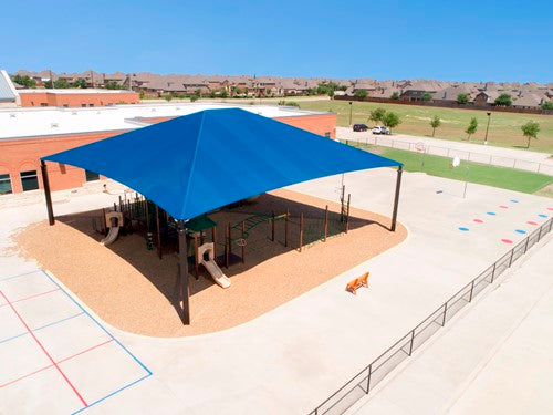 Rectangle superspan hip roof shade structure with blue fabric and four posts covering playground equipment