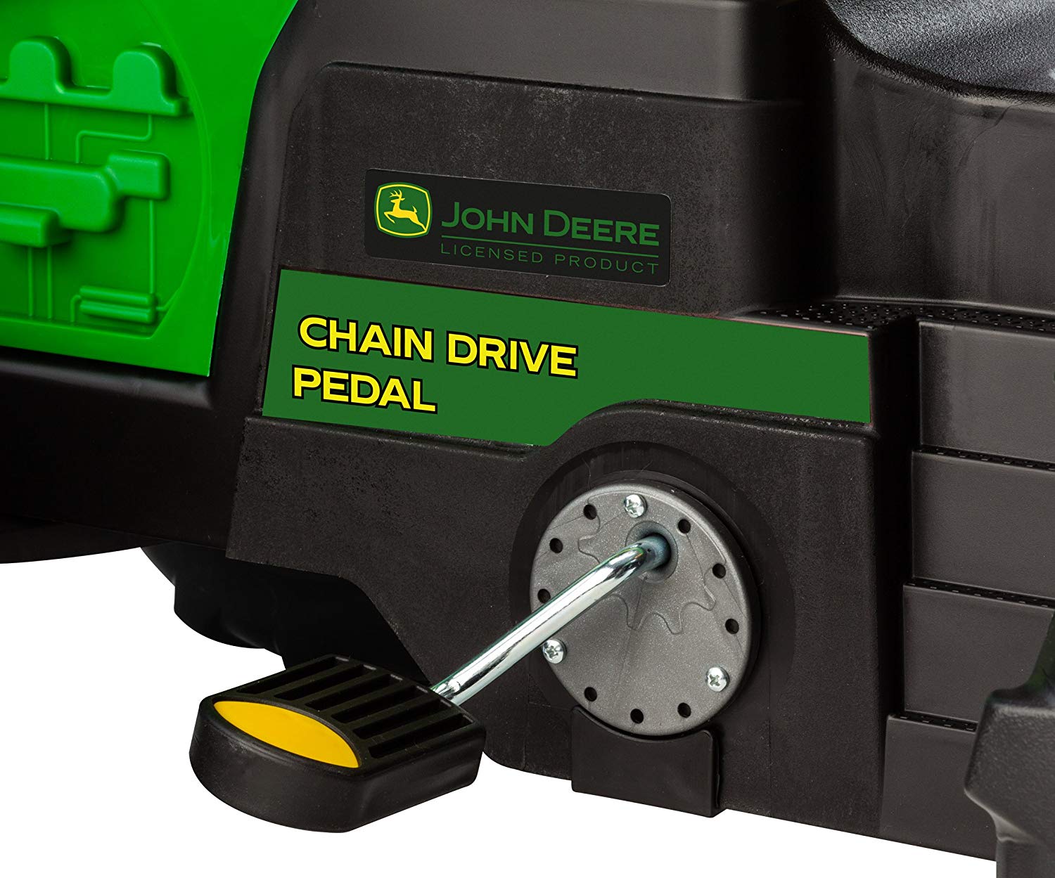 Green and black children's pedal tractor footrest and chain drive mechanism with yellow-accented details