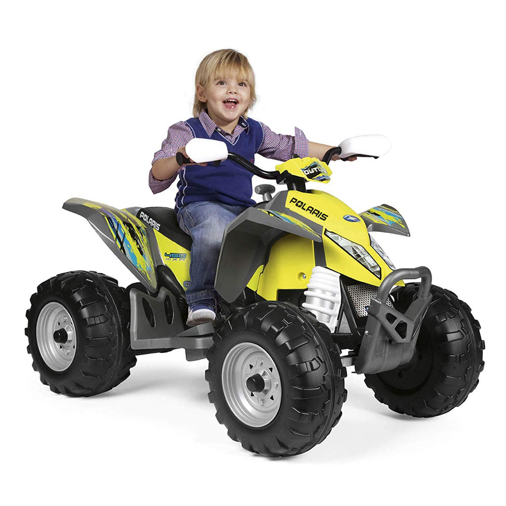 Child on yellow all-terrain kids' ride-on ATV with knobby tires and realistic design