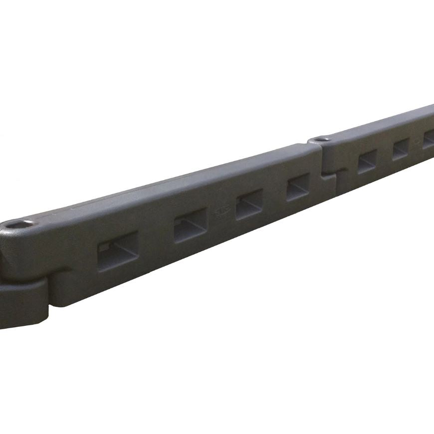 Dark gray interlocking plastic playground border with rectangular cutouts and connecting joints, angled view