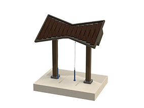 Dark brown tenor marimba with wide coated fiberglass keys and two mallets on a surface mount base