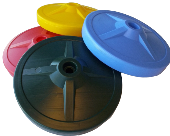 Four colorful plastic disk swing seats in blue, yellow, red, and green with central holes for nylon ropes
