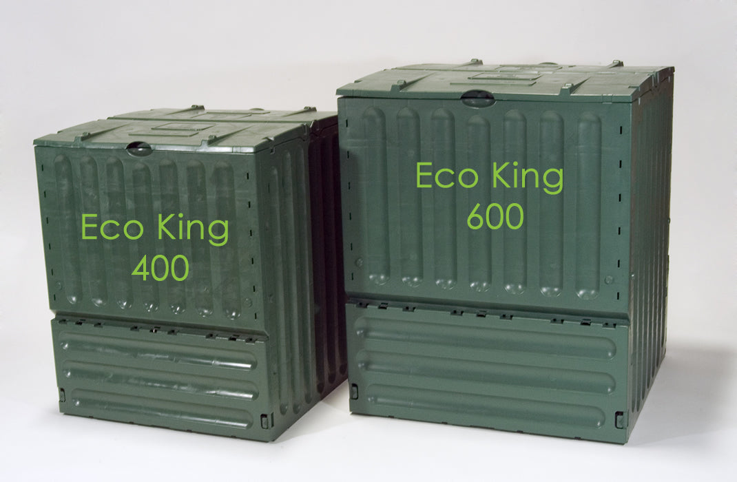 Two green vertical-ridged plastic compost bins with hinged lids, one larger and one smaller, side by side