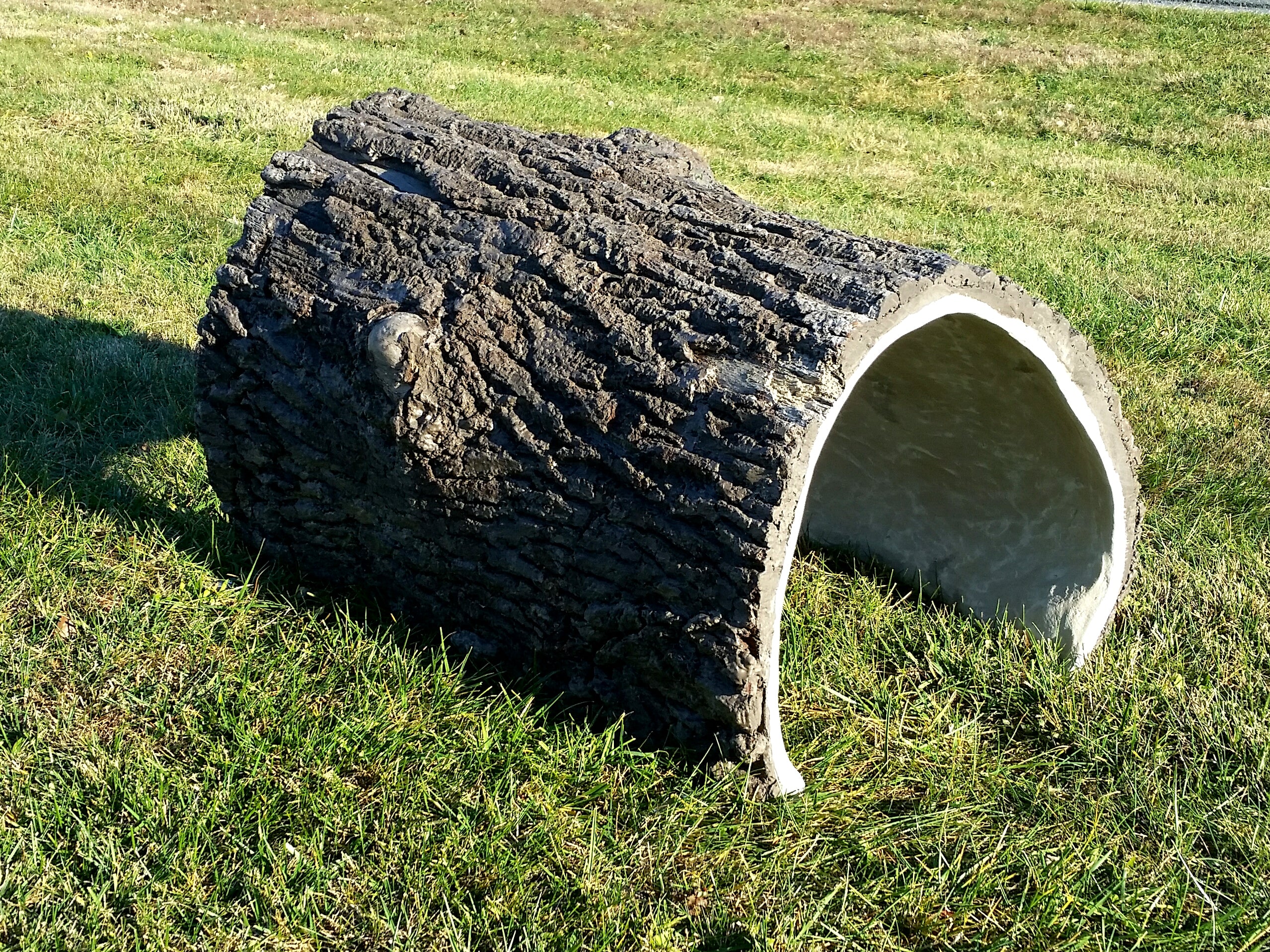 Crawl-Thru Log Tunnel with realistic bark texture, hollow interior, natural playground climbing tunnel on grass