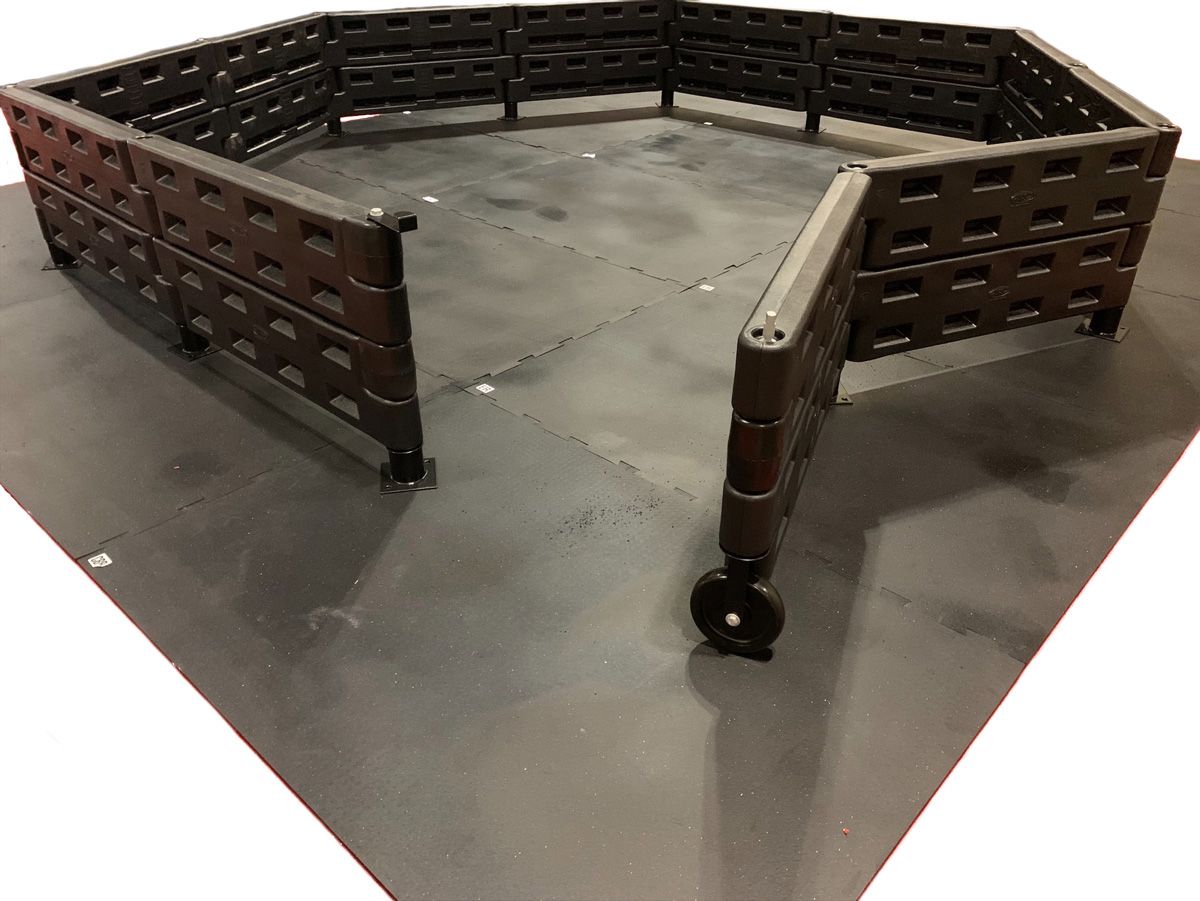 GaGa Flooring Kit with interlocking black rubber tiles and modular black plastic walls for GaGa Ball Pits, providing cushioned, safe play surface