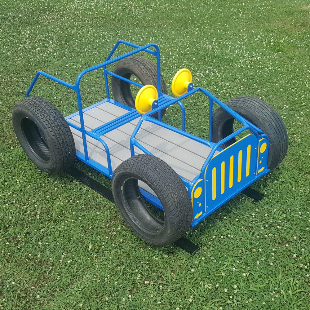 Blue and yellow jeep-themed spring rider with black tire wheels on green grass, featuring a working steering wheel and bounce spring mechanism