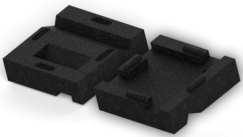 Two black reversible textured leveling blocks with slots for securing wooden swing set legs.