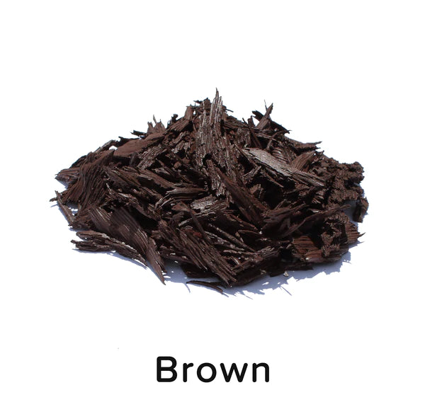 Brown loose fill rubber mulch pieces with irregular, textured shapes for playground and landscaping ground cover.