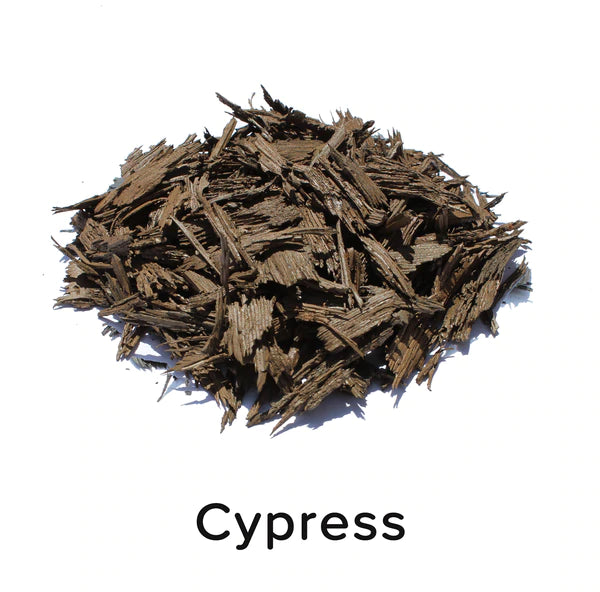 Textured, irregularly shaped loose fill rubber mulch pieces in cypress color for playground and landscaping ground cover