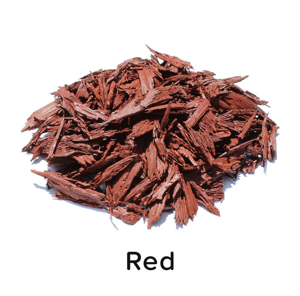 Textured, irregular red rubber mulch pieces for durable, low-maintenance playground and landscaping ground cover