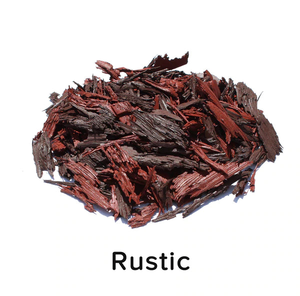 Loose fill rubber mulch with irregular, textured pieces in rustic brown and red tones for playground and landscaping use