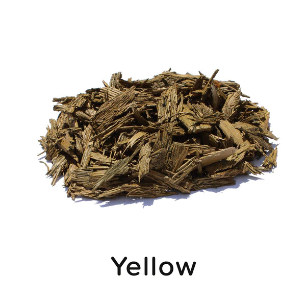 Pile of loose fill yellow rubber mulch with varied particle sizes, durable and soft playground surfacing material