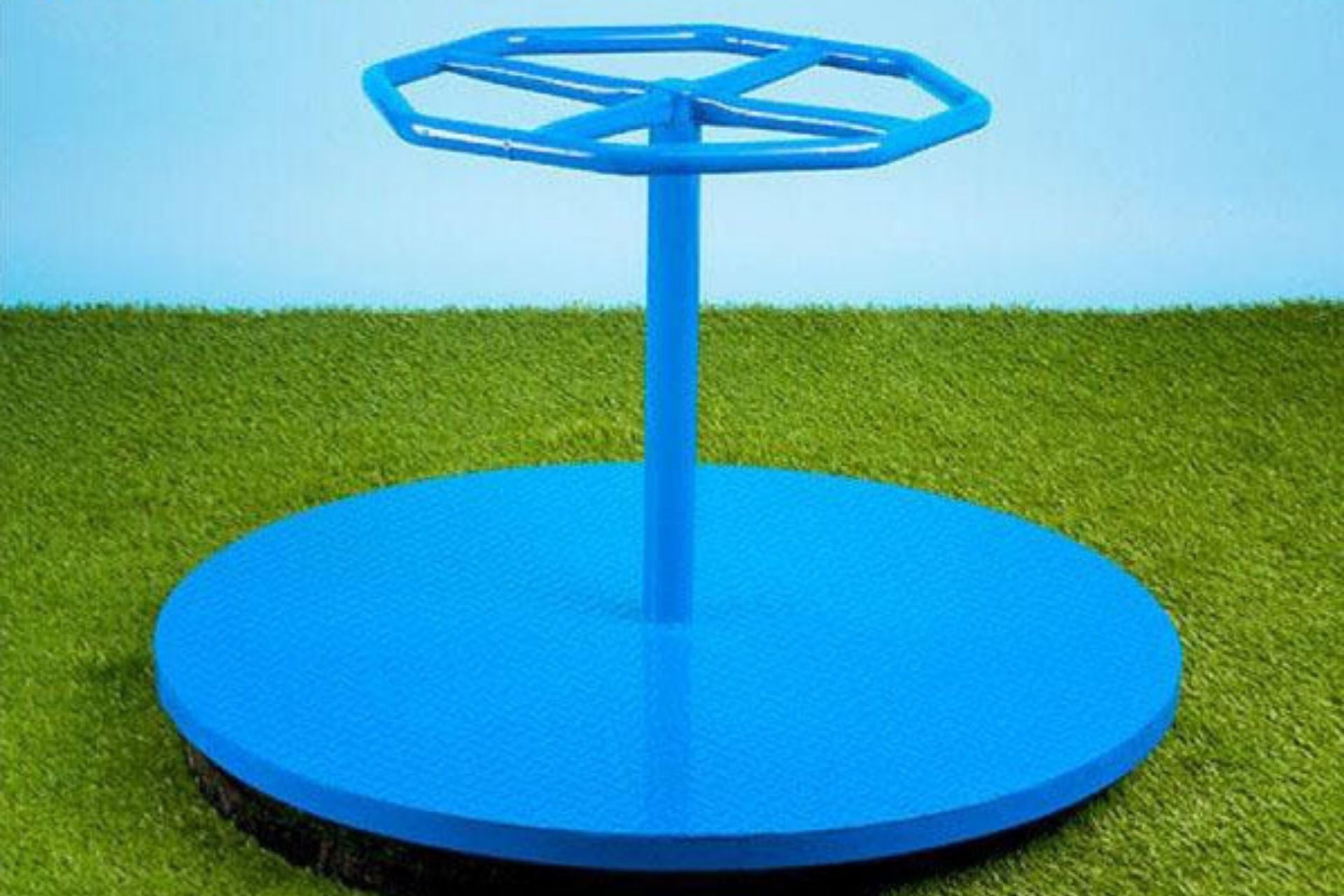 Blue steel playground merry-go-round with octagonal handrail and circular platform on grass