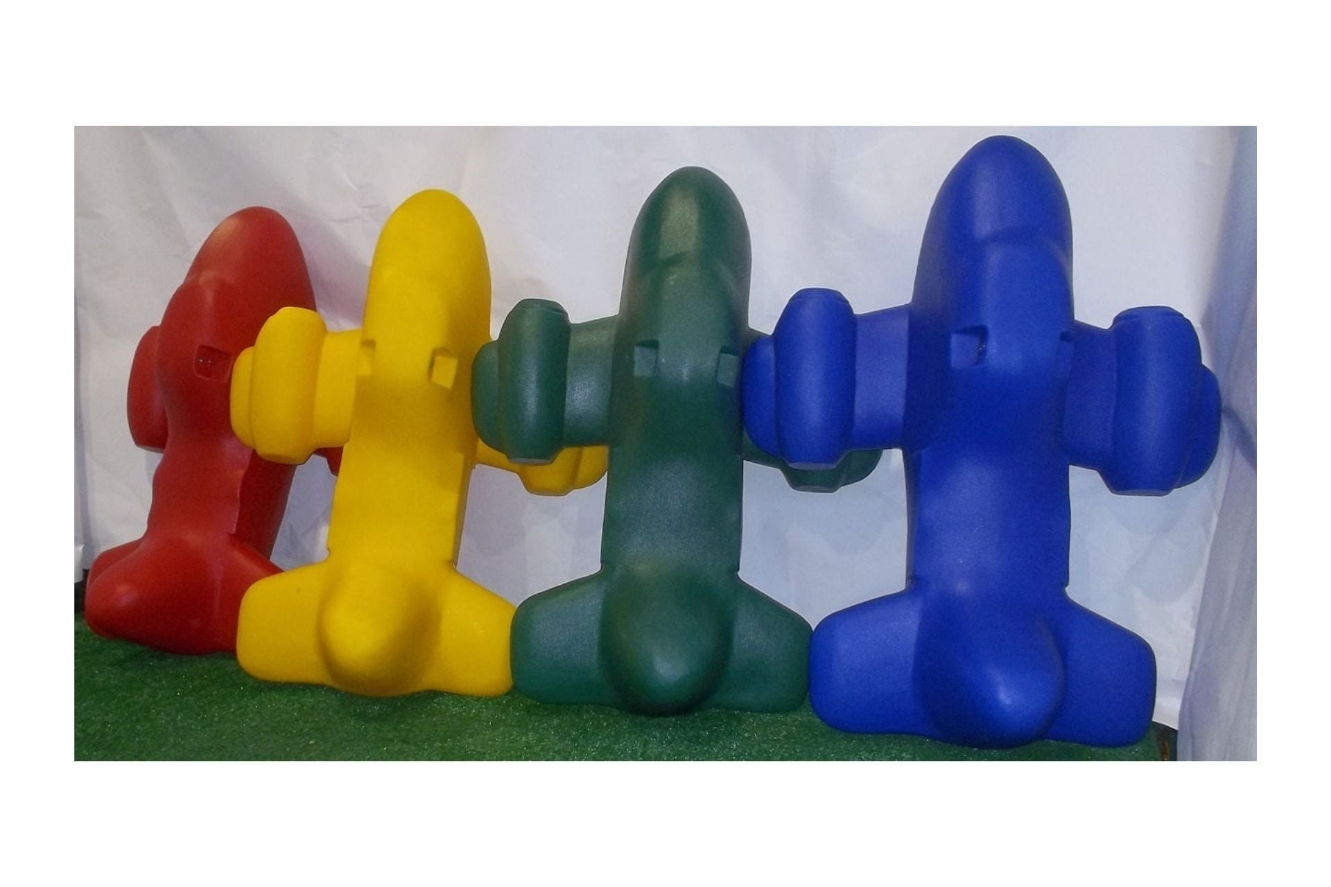 Roto Molded Spring Ride Airplane in red, yellow, green, and blue, durable polyethylene with smooth rounded shapes and weather-resistant decals