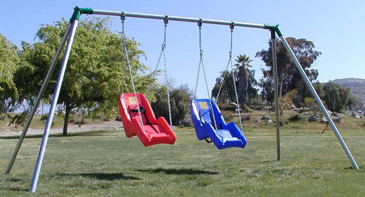 Metal frame swing set with two colorful adaptive seats, one red and one blue, on grassy outdoor playground.