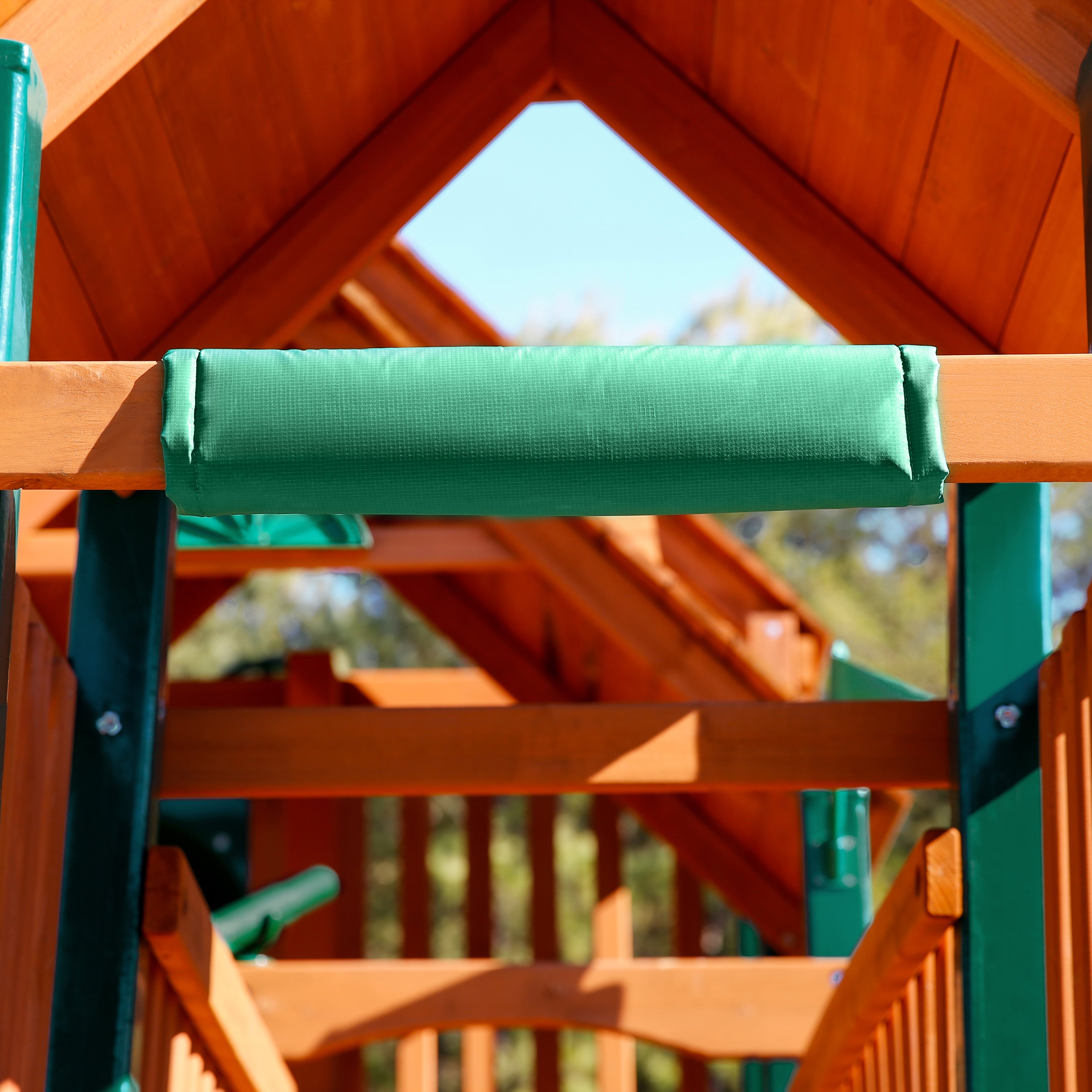 Safety Bumper Pad for Gorilla Playsets in green vinyl with foam padding attached to wooden swing set beam for protection