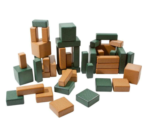 Eco Blocks by PlayMore Design, green and brown recycled plastic building blocks in various shapes stacked for creative play
